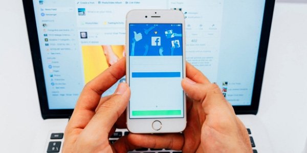 Facebook on Phone and Laptop
